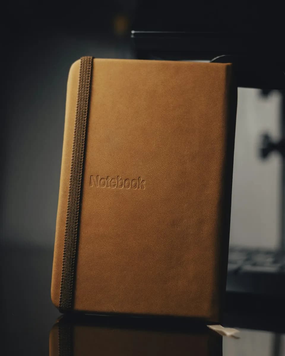 Notebook with a name pressed into the cover