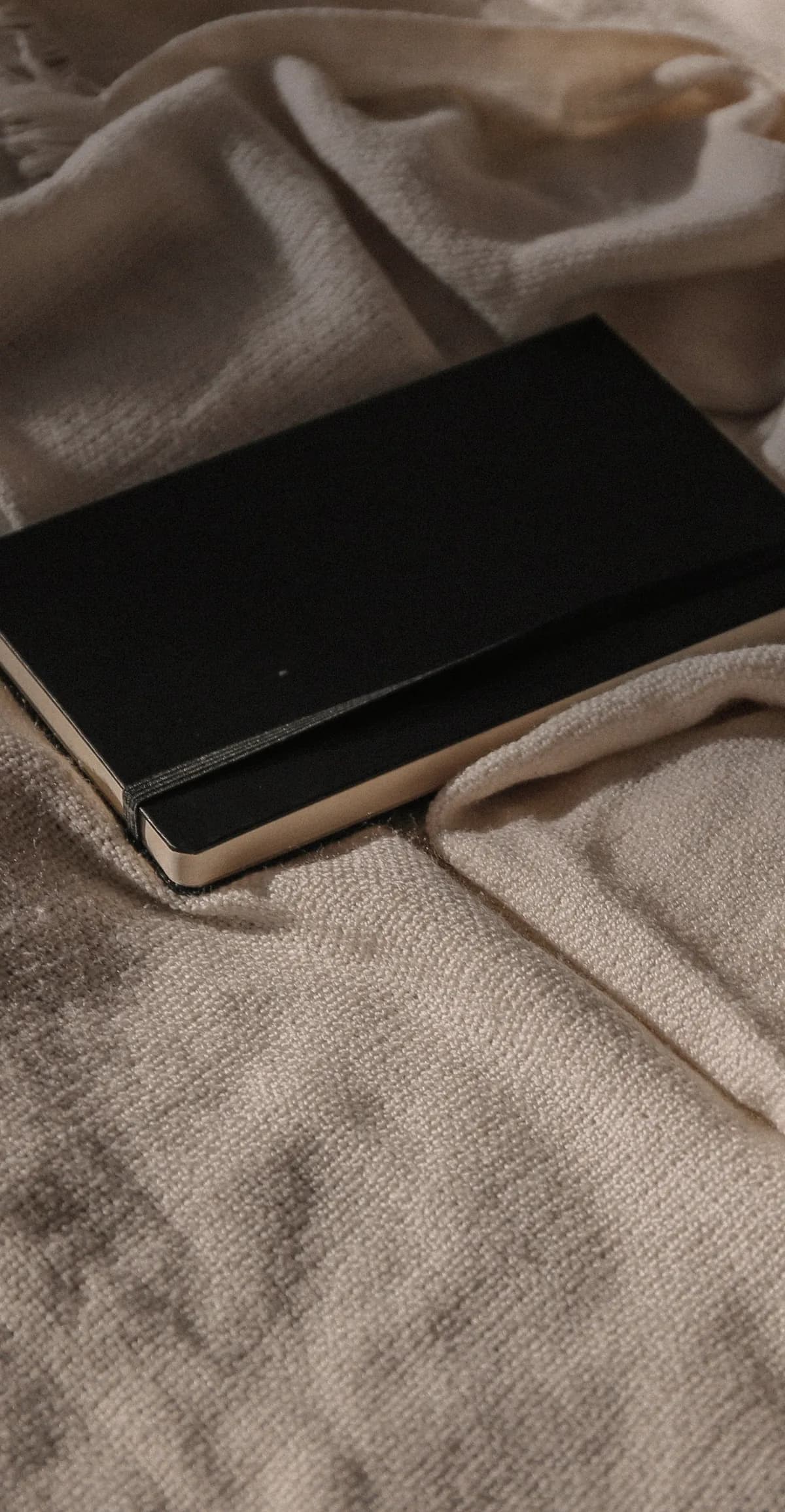 Colour Press notebook resting on a soft woven fabric