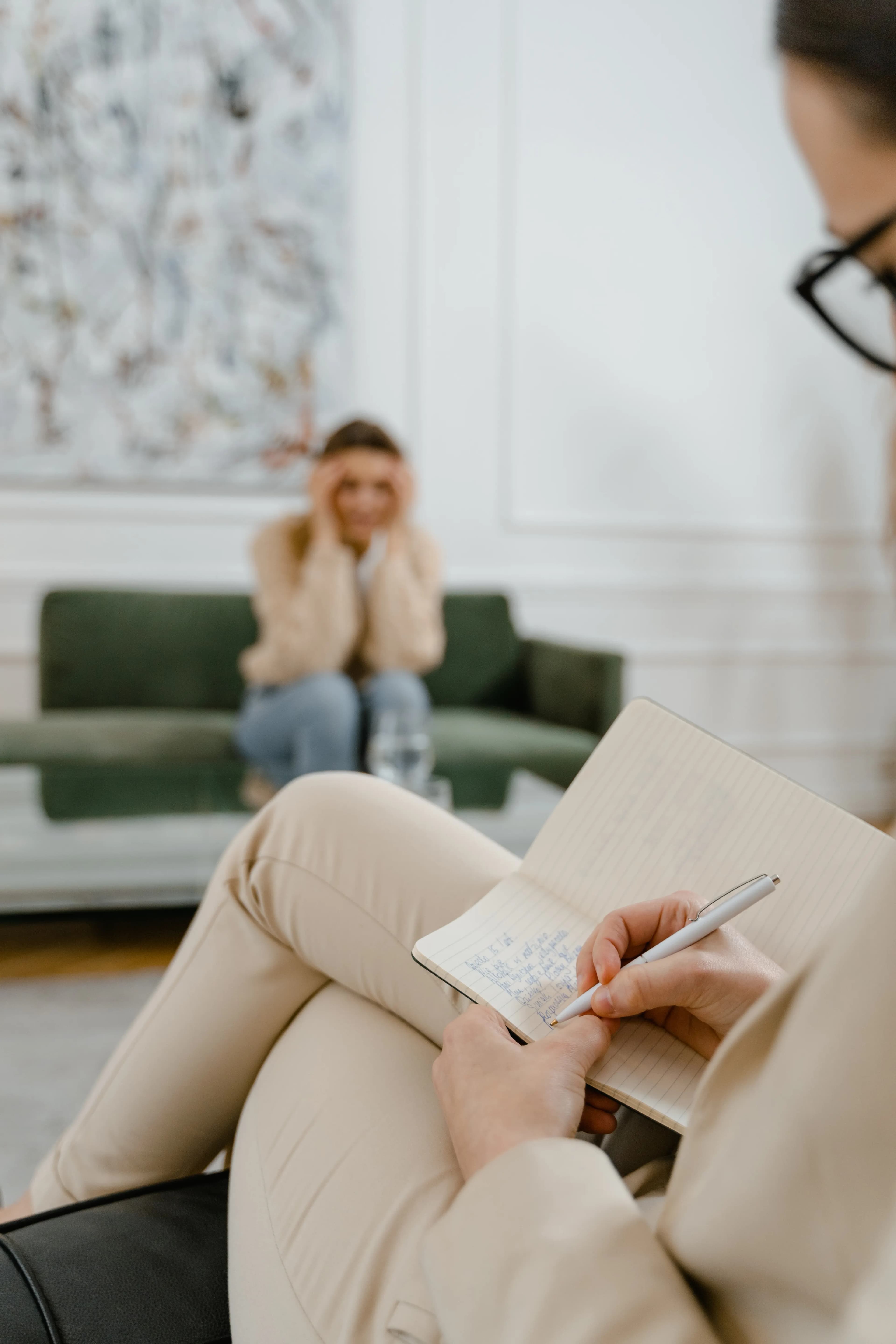 A person writing in a notebook