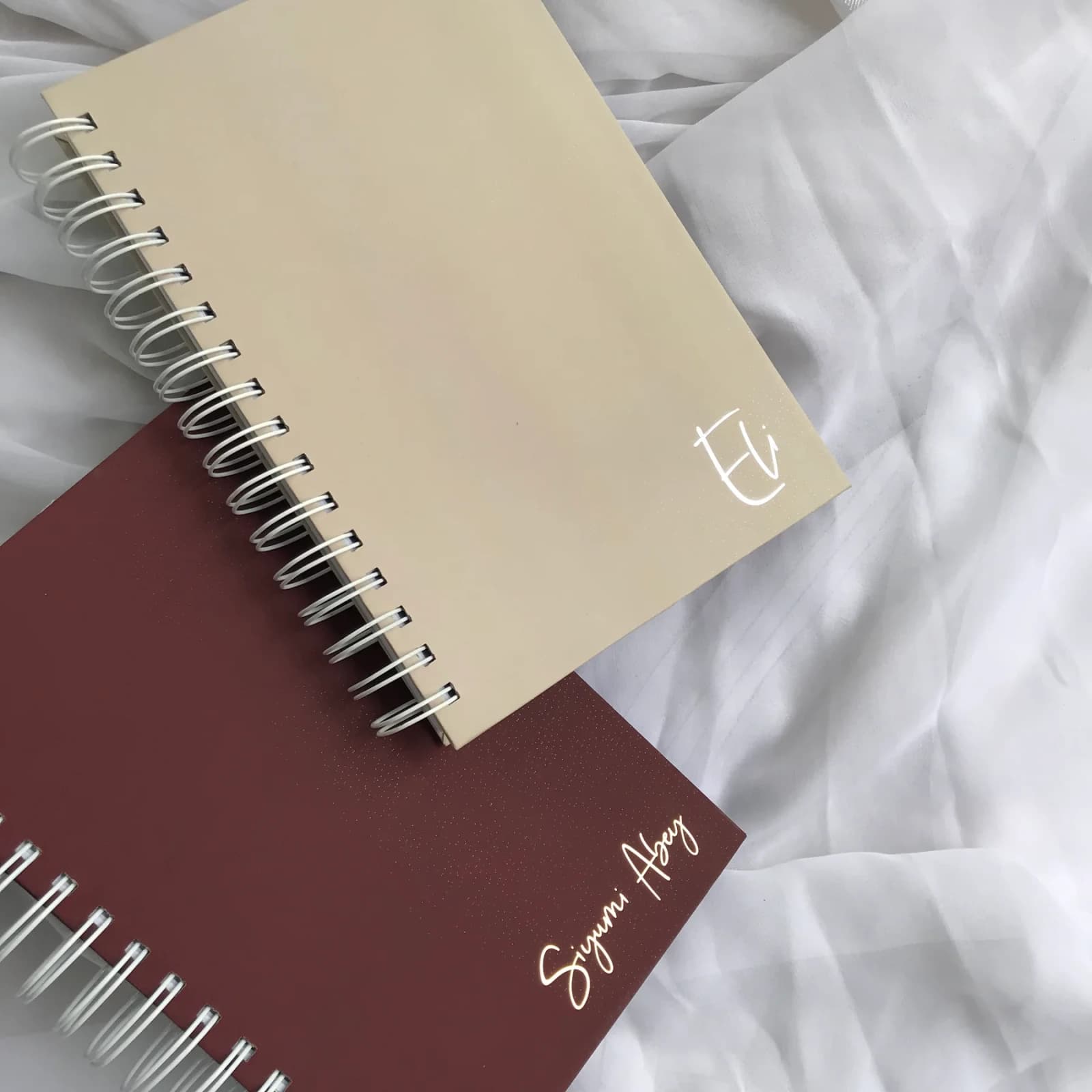 2027 Weekly Planner photographed on softly styled fabric