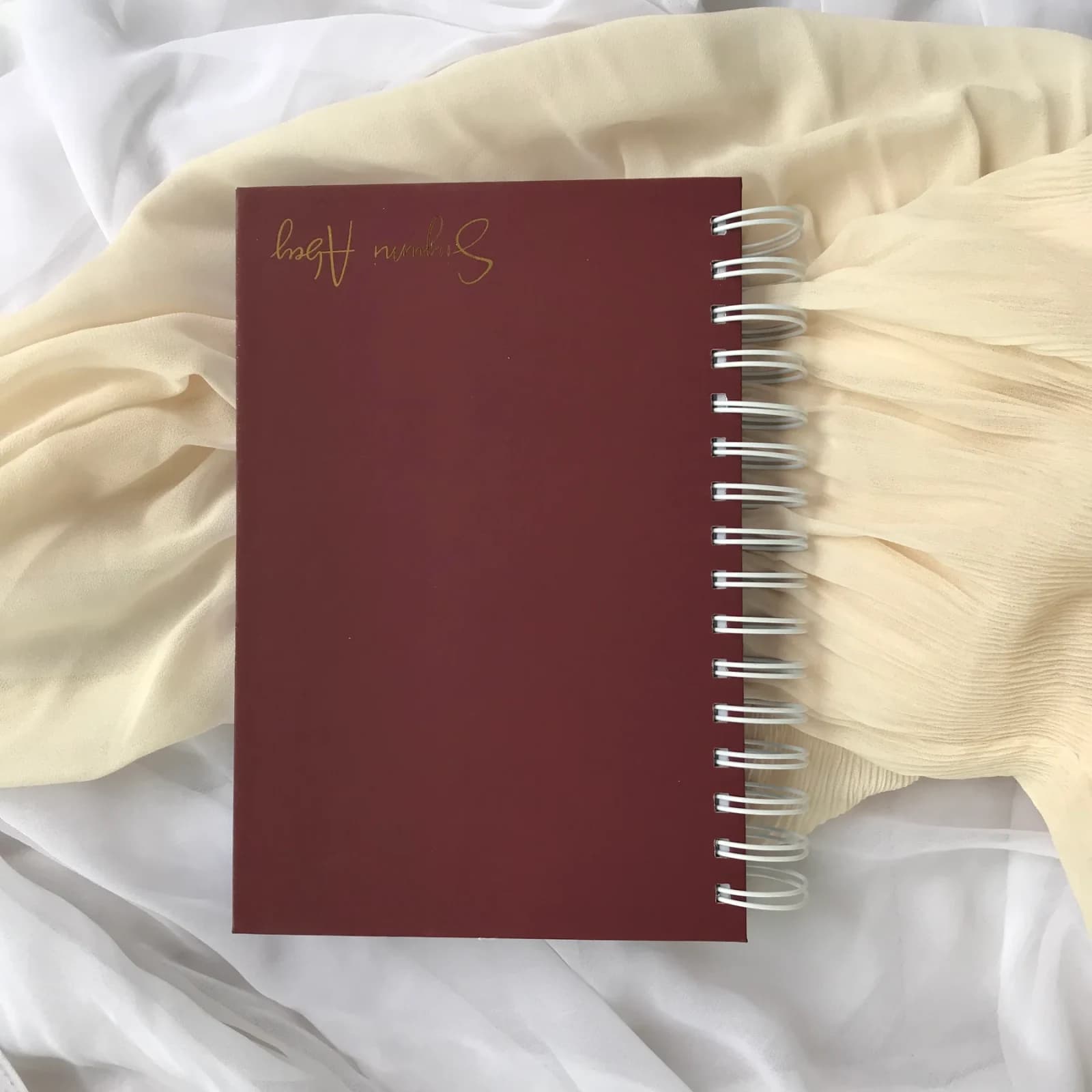 Personalised Name Notebook photographed on softly styled fabric