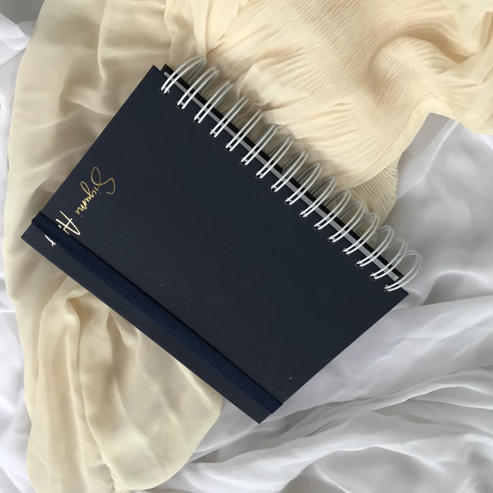 2027 Daily Planner photographed on softly styled fabric